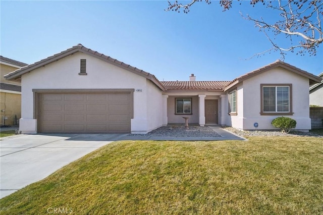 view of front of property featuring a garage and a front yard