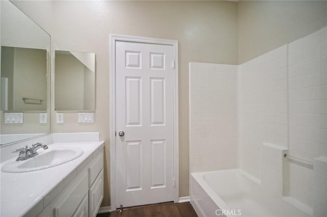 bathroom with vanity, shower / washtub combination, and hardwood / wood-style floors