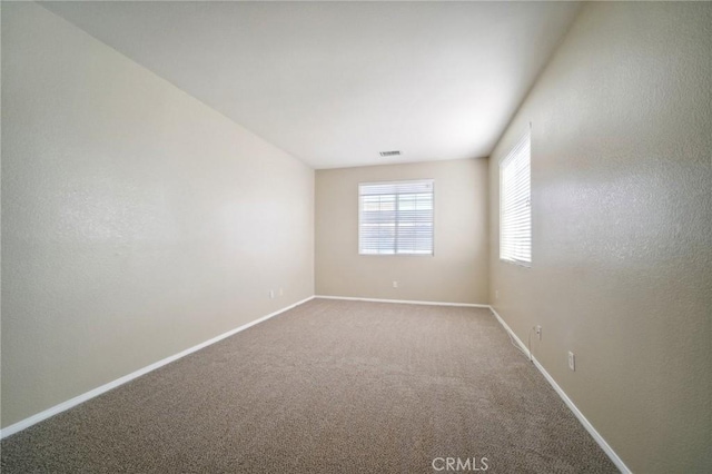 view of carpeted spare room