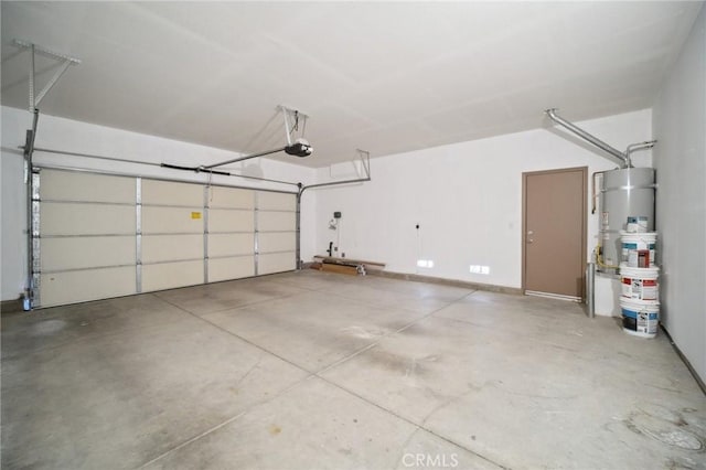 garage featuring a garage door opener and strapped water heater