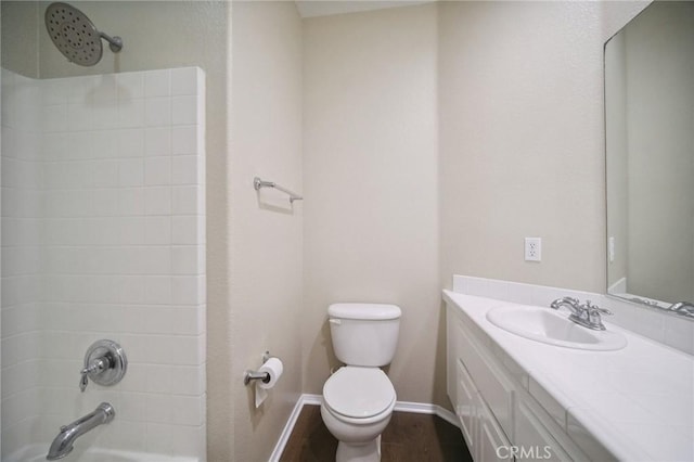 full bathroom featuring hardwood / wood-style flooring, vanity, toilet, and bathing tub / shower combination