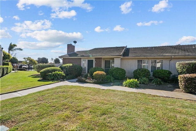 view of front of house with a front lawn