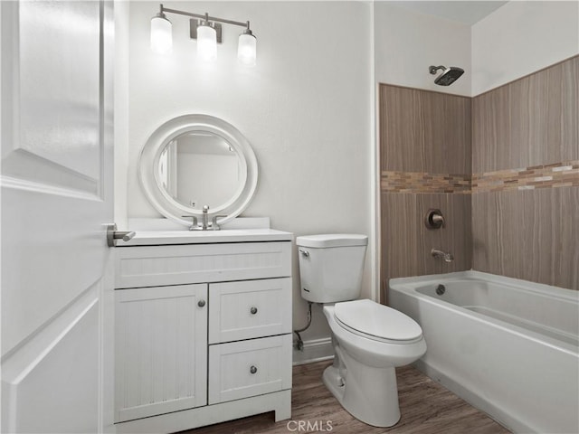 full bathroom with hardwood / wood-style flooring, vanity, toilet, and shower / bathing tub combination