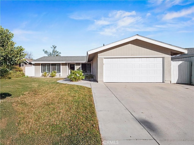 ranch-style house with a garage and a front lawn