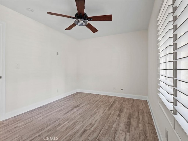 unfurnished room featuring ceiling fan and light hardwood / wood-style floors