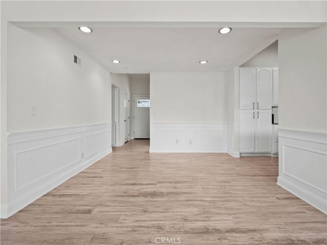 spare room featuring light wood-type flooring