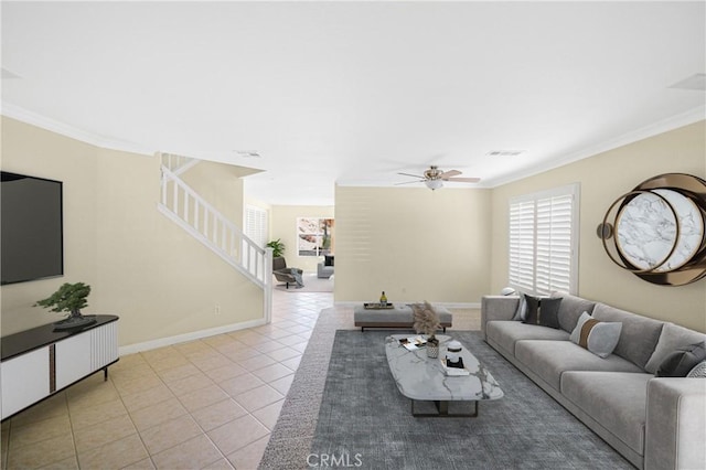 tiled living room featuring ornamental molding and ceiling fan