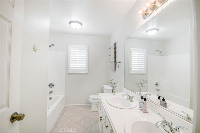 full bathroom with tile patterned flooring, vanity, shower / bathtub combination, and toilet