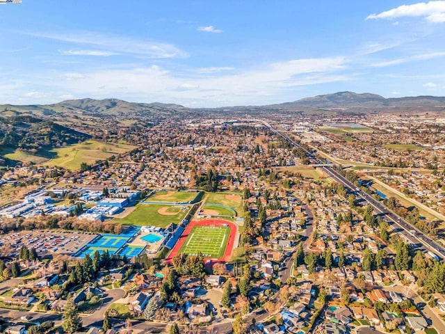 birds eye view of property featuring a mountain view