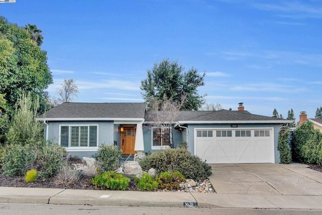 single story home featuring a garage