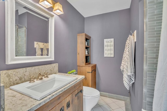 bathroom with vanity, tile patterned floors, and toilet