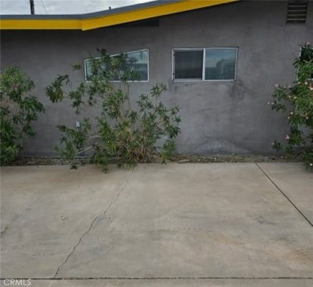 view of side of property with a patio area