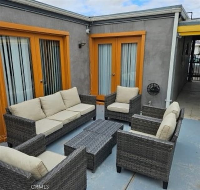 view of patio featuring outdoor lounge area and french doors