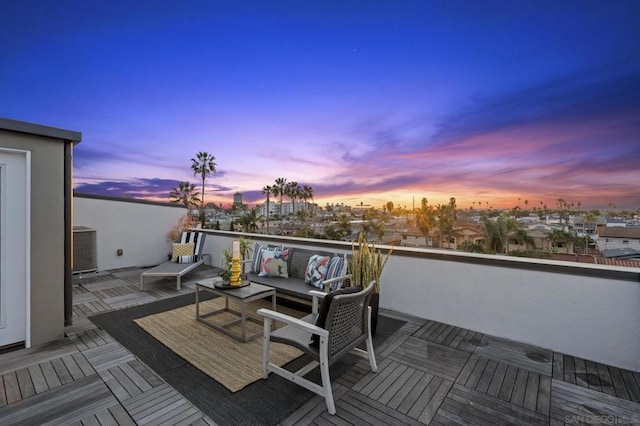 deck at dusk with central AC unit