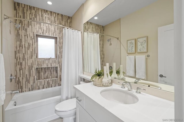 full bathroom featuring shower / bath combo, vanity, and toilet