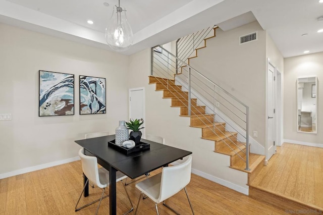 dining area with light hardwood / wood-style flooring