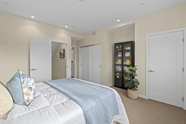 bedroom featuring light colored carpet