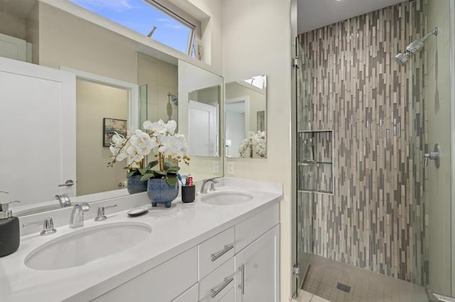 bathroom featuring an enclosed shower and vanity