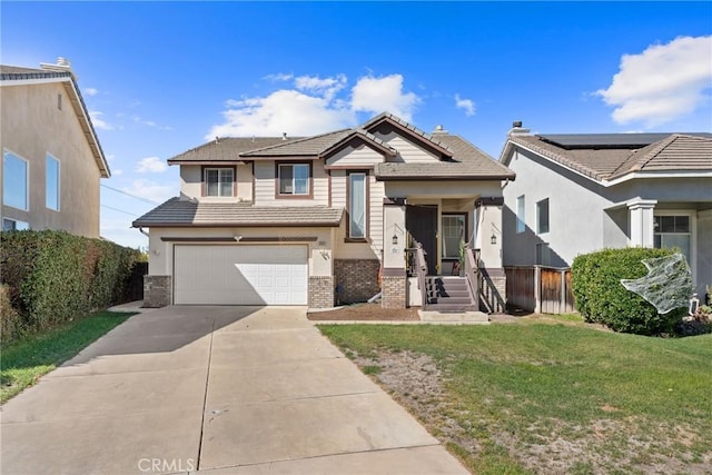 view of front of property featuring a garage and a front lawn