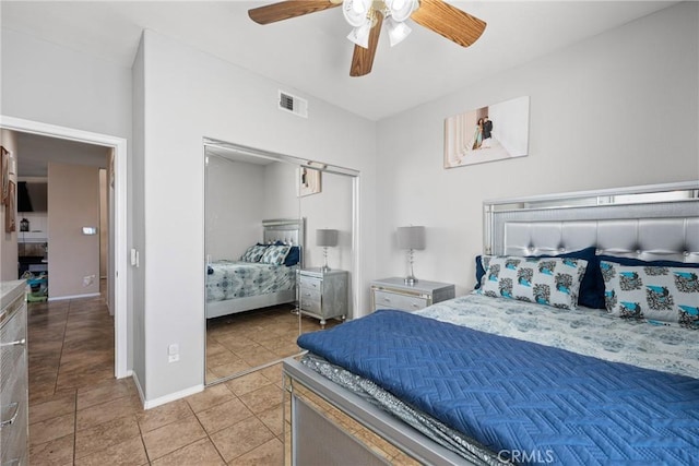 tiled bedroom with ceiling fan