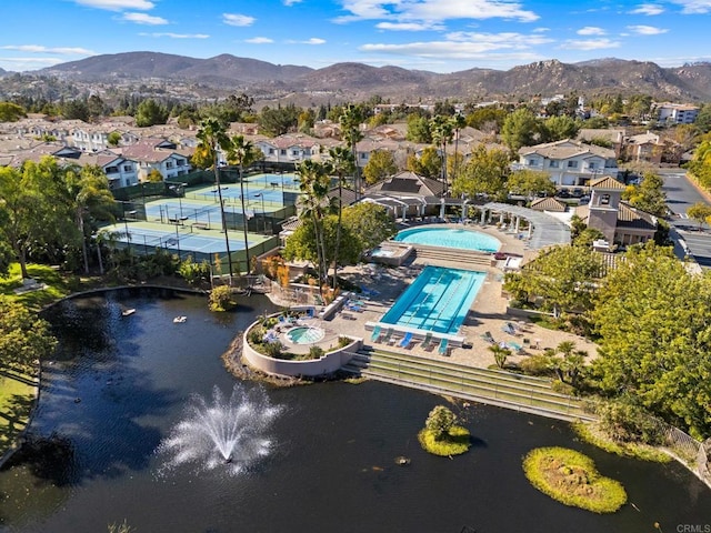 birds eye view of property with a residential view and a water and mountain view