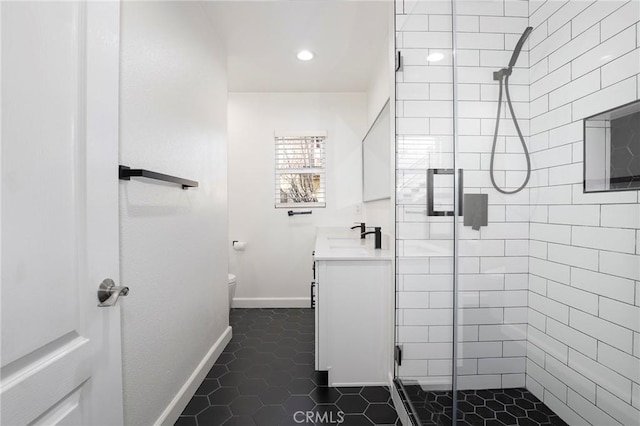 bathroom featuring tile patterned floors, vanity, toilet, and a shower with door