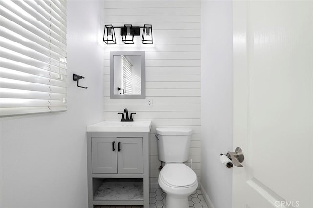 bathroom featuring vanity and toilet