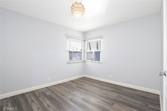 unfurnished room featuring dark hardwood / wood-style floors