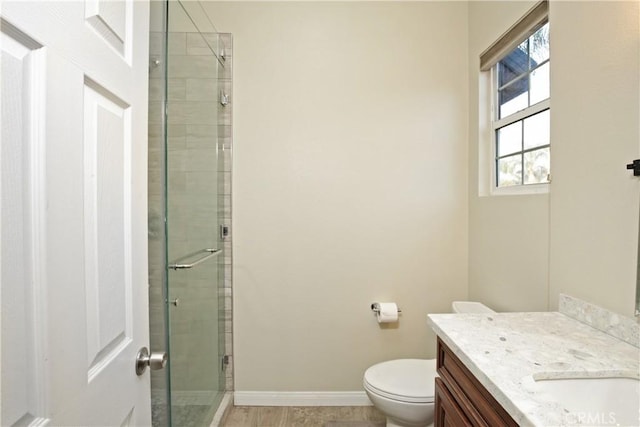 16082 Citrus Grove Ct, Riverside, CA 92504 - full bathroom featuring vanity, baseboards, a stall shower, and toilet