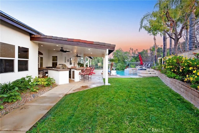 16082 Citrus Grove Ct, Riverside, CA 92504 - view of yard featuring a ceiling fan, a jacuzzi, outdoor dry bar, and a patio area