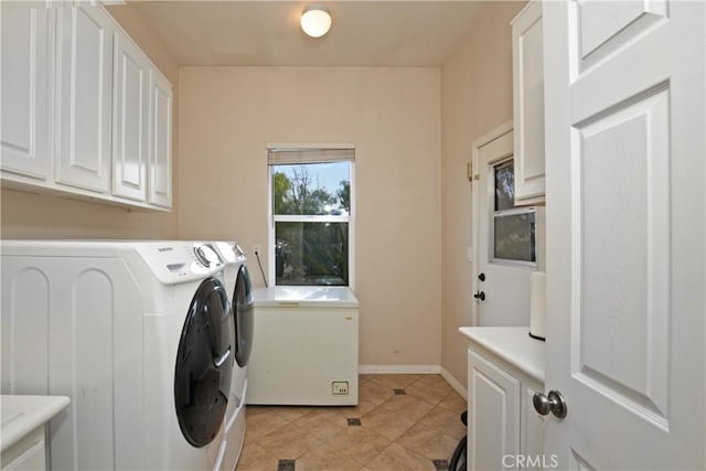 16082 Citrus Grove Ct, Riverside, CA 92504 - laundry area with baseboards, cabinet space, light tile patterned floors, and washer and dryer