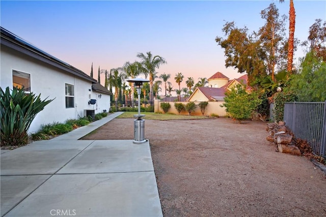 16082 Citrus Grove Ct, Riverside, CA 92504 - view of yard with central AC unit, a patio area, and fence