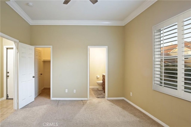16082 Citrus Grove Ct, Riverside, CA 92504 - unfurnished bedroom featuring a walk in closet, ornamental molding, and baseboards