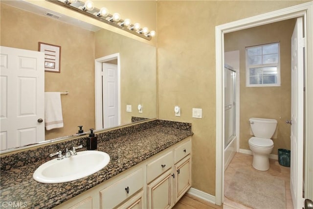 16082 Citrus Grove Ct, Riverside, CA 92504 - full bath featuring visible vents, vanity, toilet, baseboards, and tile patterned floors