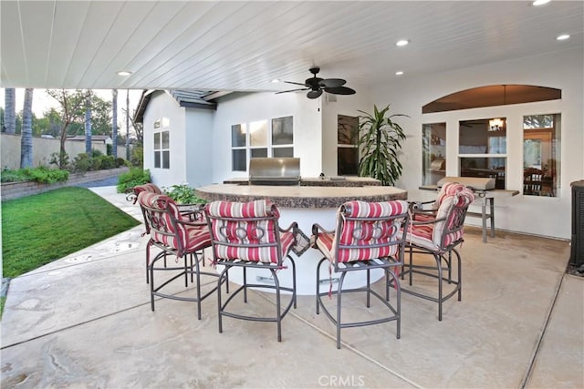 16082 Citrus Grove Ct, Riverside, CA 92504 - view of patio featuring ceiling fan, outdoor wet bar, exterior kitchen, and a grill