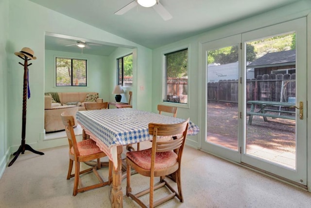 dining space featuring lofted ceiling, a wealth of natural light, and ceiling fan