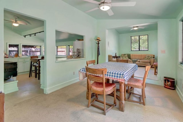 dining space featuring lofted ceiling and ceiling fan