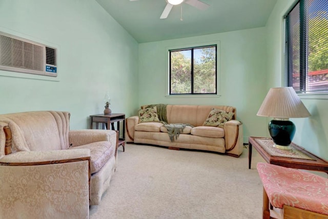 living room featuring lofted ceiling, a wealth of natural light, and ceiling fan