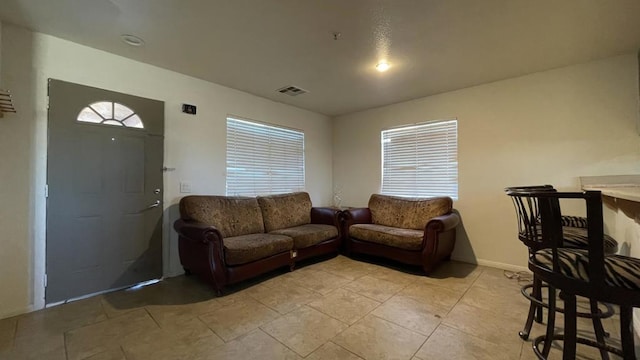 living room with light tile patterned flooring