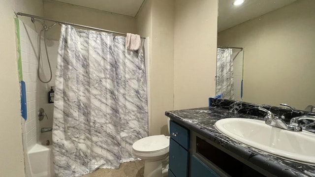 full bathroom with vanity, shower / bath combo, and toilet