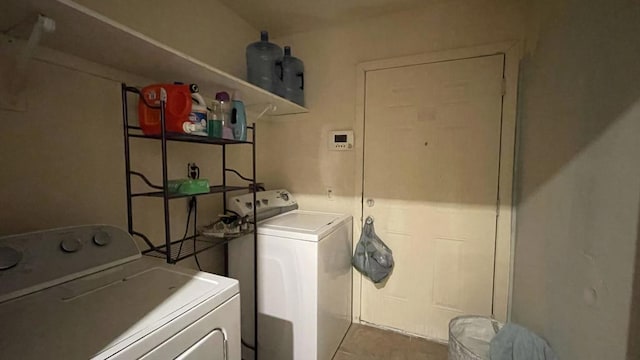 clothes washing area with separate washer and dryer