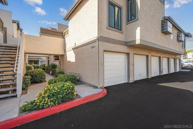 view of property exterior with a garage