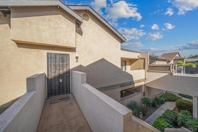 entrance to property with a balcony