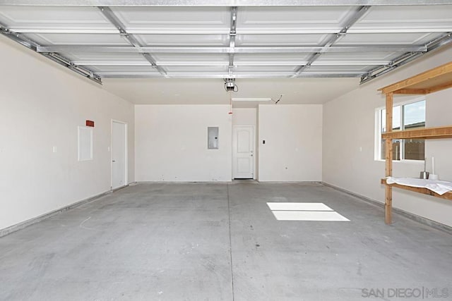 garage featuring a garage door opener and electric panel