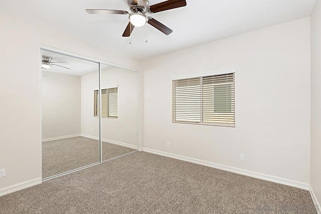 unfurnished bedroom with a closet, ceiling fan, and carpet