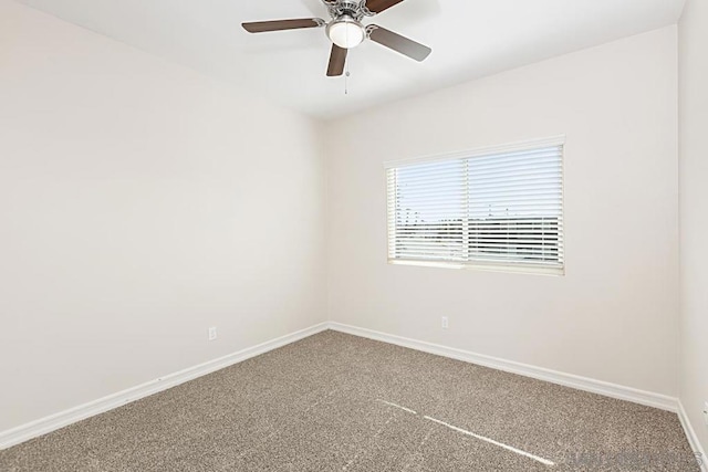 empty room with ceiling fan and carpet flooring