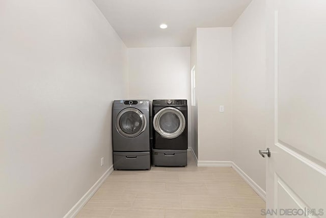 clothes washing area featuring washing machine and dryer