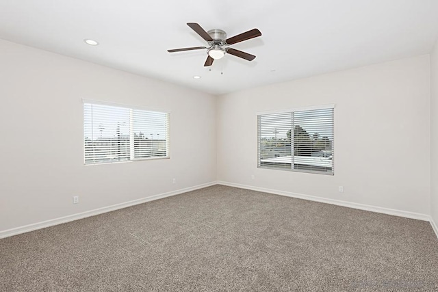 carpeted empty room with ceiling fan