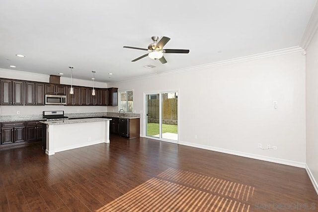 kitchen featuring dark brown cabinets, stainless steel appliances, dark hardwood / wood-style floors, a kitchen island, and decorative light fixtures