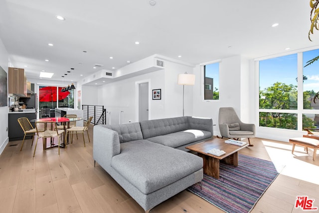 living room with light hardwood / wood-style flooring